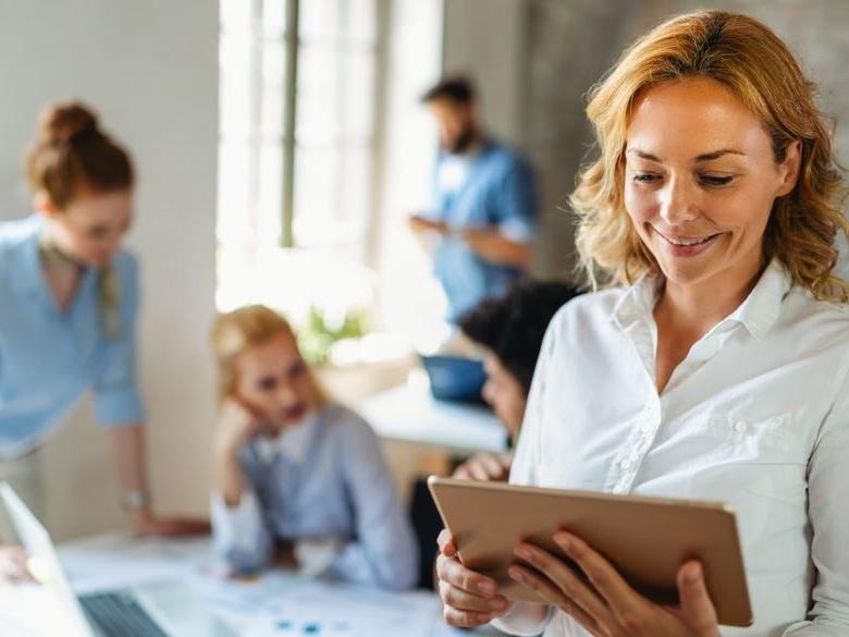 A woman looking at a tablet